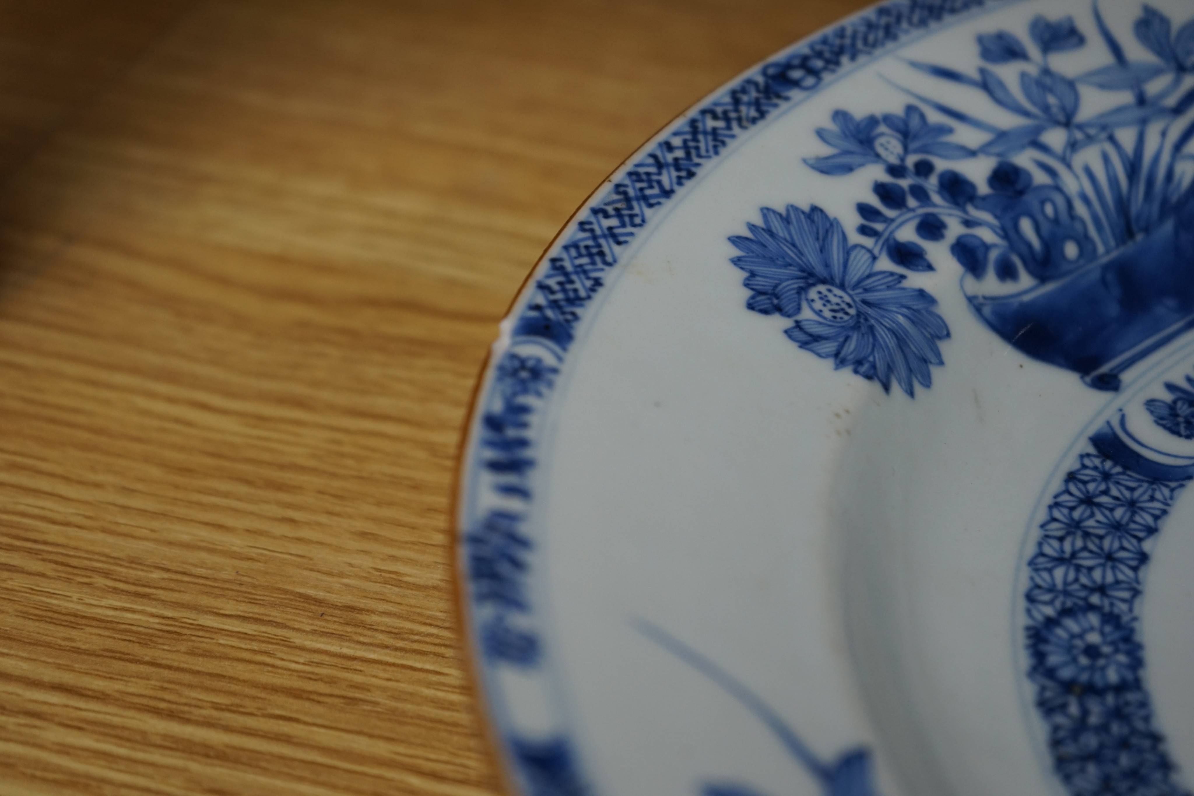 An 18th century Chinese blue and white circular dish decorated with flowering plants, Dia 32.5cm